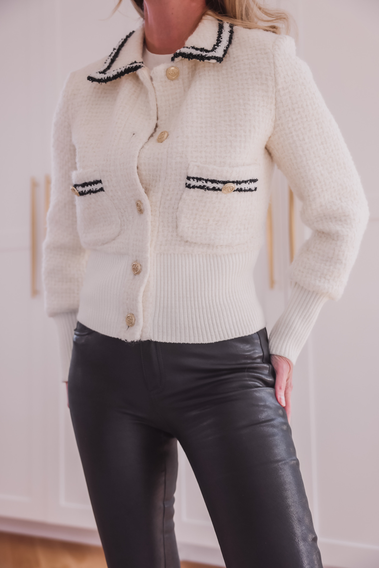 white maje cardigan, black frame leather pants